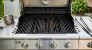 Heavy duty cast iron cooking grates of an affordable four burner grill under 500 dollars.