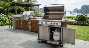 Freestanding premium gas grill cart with enclosed cabinet storage for a liquid propane tank.